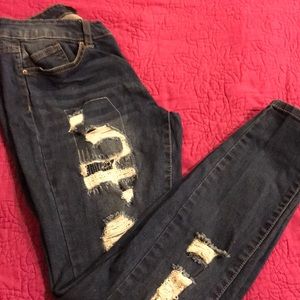 Distressed denim jeans